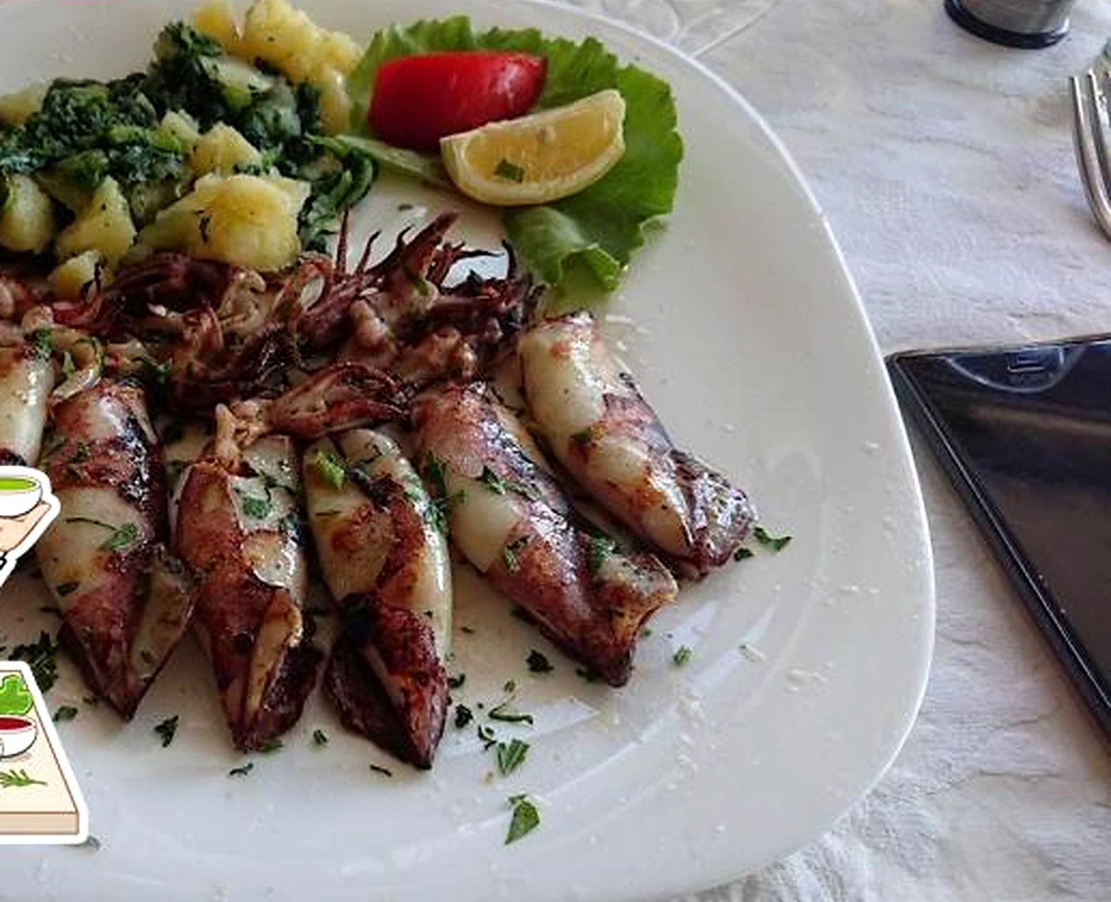 Lignje sa žara i prilog u restoranu Moretto